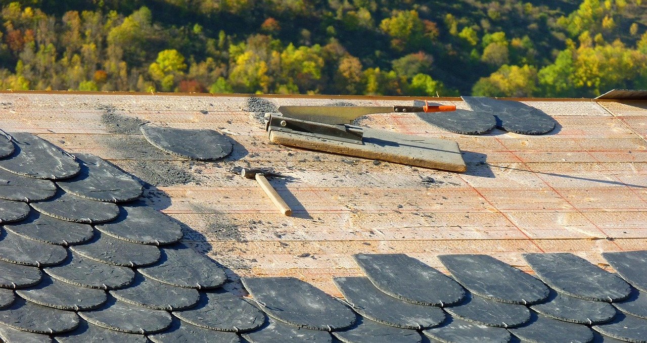 Roofer working on a flat membrane roof